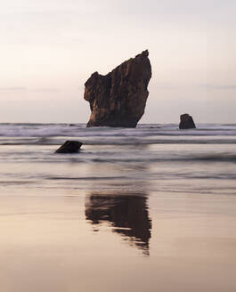 Boulder rock amidst sea at sunset - MMPF00947