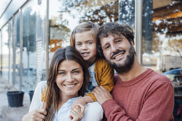 Happy mother and father with daughter - JOSEF21073