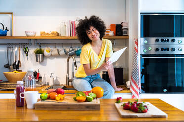 Beautiful latino young woman at home - Pretty south american with curly hair female portrait, lifestyle and domestic life scene - DMDF05800