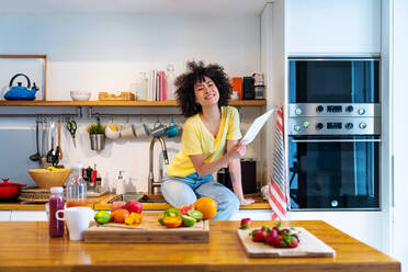 Beautiful latino young woman at home - Pretty south american with curly hair female portrait, lifestyle and domestic life scene - DMDF05801