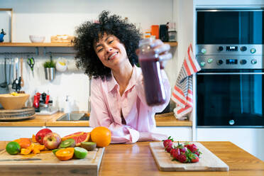 Beautiful latino young woman at home - Pretty south american with curly hair female portrait, lifestyle and domestic life scene - DMDF05817