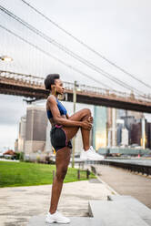 Young fitness woman running in New York - Sportive girl training outdoors, concepts about sport and healthy lifestyle - DMDF06441