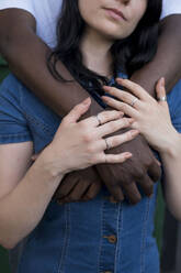 Young man standing with arm around woman - AMWF01769