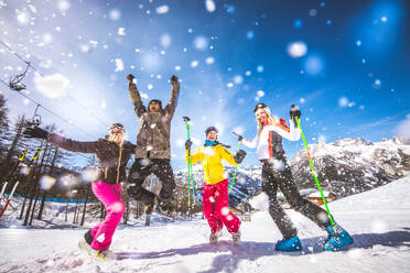 Group of friends with ski on winter holidays - Skiers having fun on the snow - DMDF06599