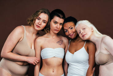 Four young men and women wearing underwear stock photo