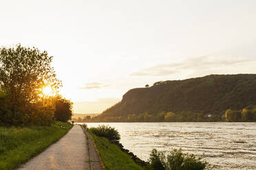Germany, Rhineland-Palatinate, Remagen, Rhine river promenade at sunset - GWF07925