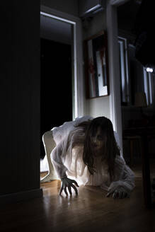 Spooky female ghost crawling in house - MASF39604