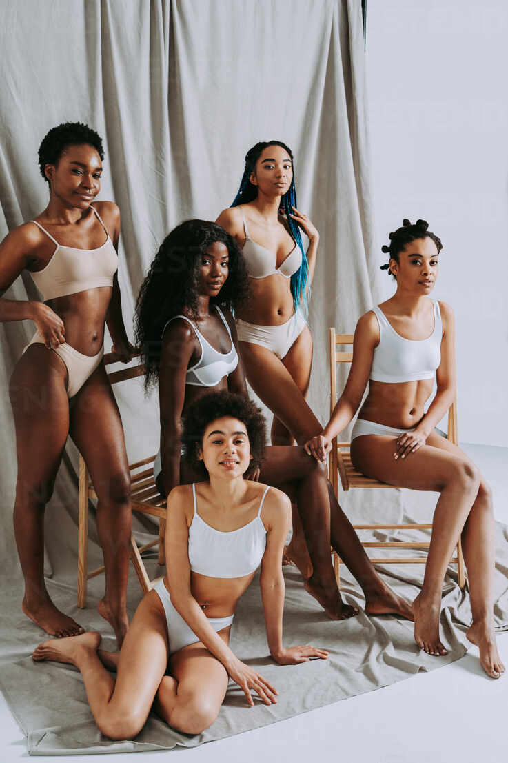Beauty portrait of beautiful black women wearing lingerie underwear - Pretty  african young women posing in studio, concepts about beauty, cosmetology  and diversity stock photo