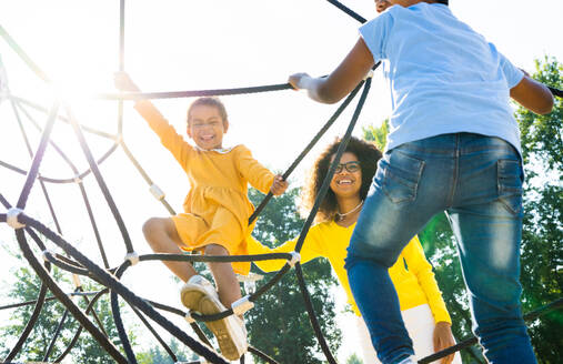 Beautiful happy african american family bonding at the park - Black family having fun outdoors - DMDF07208