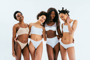 Beauty portrait of beautiful black women wearing lingerie underwear - Pretty african young women posing in studio, concepts about beauty, cosmetology and diversity - DMDF07225