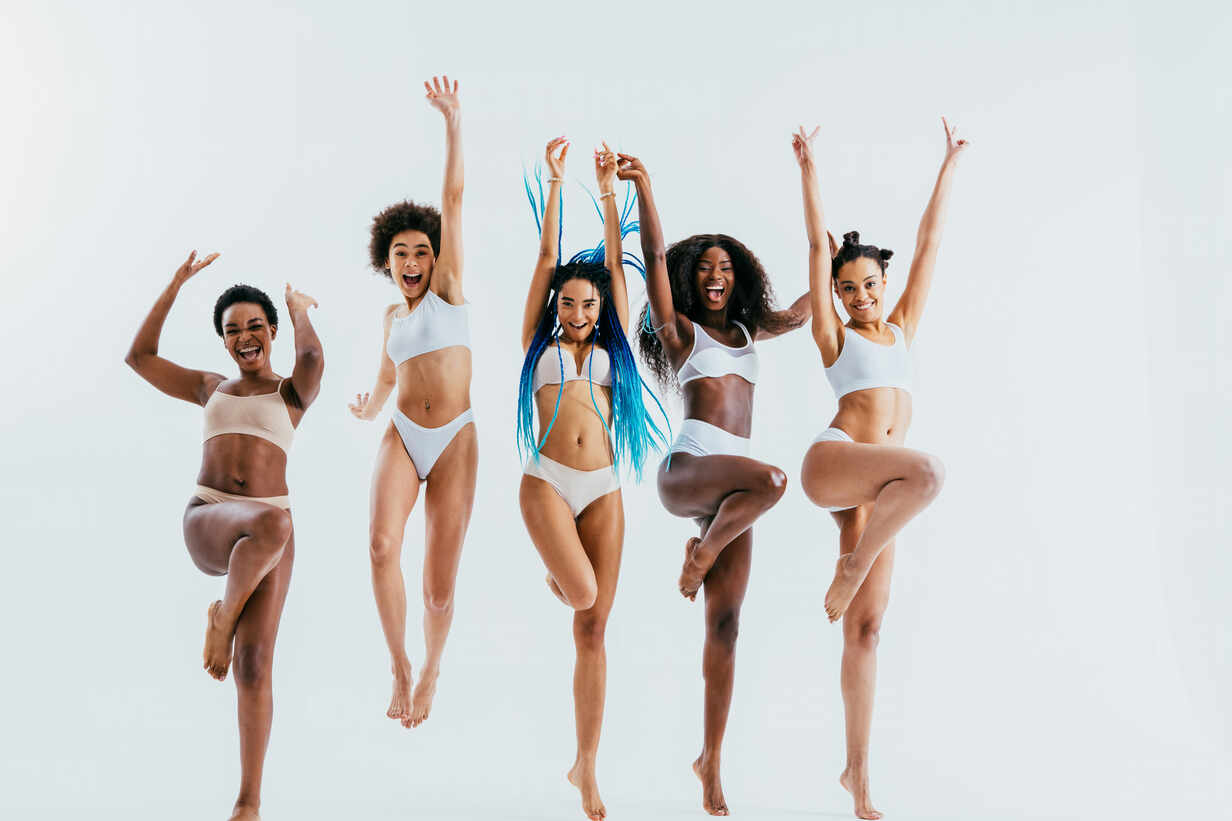 Beauty portrait of beautiful black women wearing lingerie underwear -  Pretty african young women posing in studio, concepts about beauty,  cosmetology and diversity stock photo