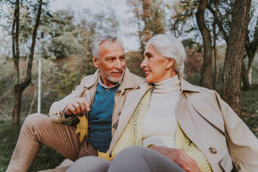 Beautiful senior couple dating outdoors - Mature couple portrait, concepts about elderly and lifestyle - DMDF07265