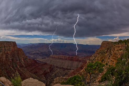 Lightning striking inside the Grand Canyon during the 2023 Arizona Monsoon season, viewed from No Name Overlook between Pinal Point on the left and Lipan Point on the right, Grand Canyon National Park, UNESCO World Heritage Site, Arizona, United States of America, North America - RHPLF28511
