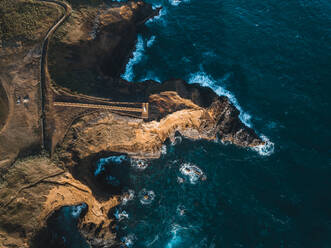 Aerial view of the coasts and cliffs of the island of Sao Miguel over the lighthouse of Farolim dos Fenais da Ajuda, Azores Islands, Portugal, Atlantic, Europe - RHPLF28518