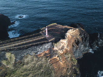 Aerial view of Farolim dos Fenais da Ajuda lighthouse on a cliff, Sao Miguel island, Azores Islands, Portugal, Atlantic, Europe - RHPLF28525