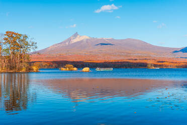 Vibrant autumn colors reflecting in Lake Onuma, with view to Hokkaido Koma-ga-take volcano, Onuma, Hokkaido, Japan, Asia - RHPLF28705