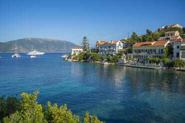 View of hotels overlooking Fiscardo harbour, Fiscardo, Kefalonia, Ionian Islands, Greek Islands, Greece, Europe - RHPLF28727