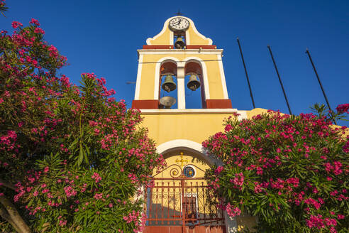 View of church bell tower overlooking Fiscardo harbour, Fiscardo, Kefalonia, Ionian Islands, Greek Islands, Greece, Europe - RHPLF28731