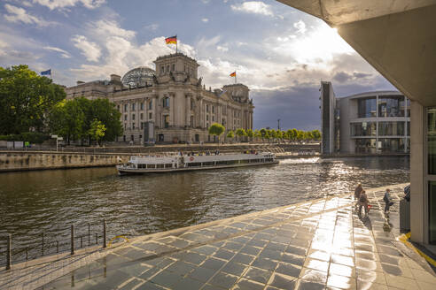 View of sightseeing cruise boat on River Spree and the Reichstag (German Parliament building), Mitte, Berlin, Germany, Europe - RHPLF28871