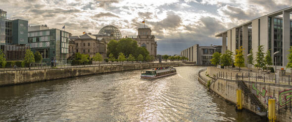 View of sightseeing cruise boat on River Spree and the Reichstag (German Parliament building), Mitte, Berlin, Germany, Europe - RHPLF28875