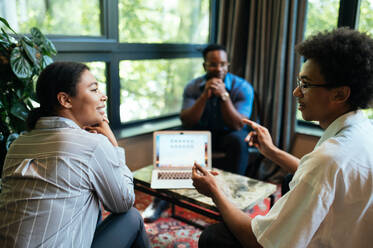 Cinematic image of people working in a start up business. Multiethnic team of experts working together to develop the new projects - DMDF07539