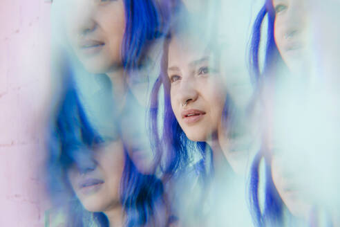 Multiple image of woman with blue dyed hair - YTF01252