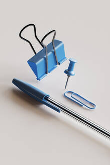 3D render of blue colored office supplies floating against white background - GCAF00438