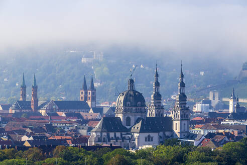 Germany, Bavaria, Wurzburg, Fog gathering over St John in Stift Haug - NDF01594