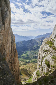 Gorge with rough giant rocks in Pena Foratata mountain range located against blue sky in nature of Aragon Pyrenees in Spain - ADSF48196