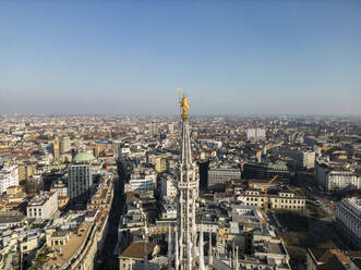 Drone view of rooftop of medieval Catholic cathedral Notre Dame and tourists on street in Paris in sunlight - ADSF48234