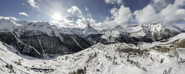 Amazing panoramic view of rough peaks in snow of Alp mountain ridge in valley of Switzerland under blue sky - ADSF48245