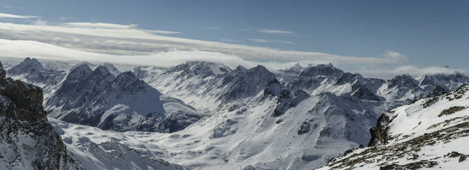 Picturesque view of rocky snowy mountains located against cloudy sky in winter on Ushuaia Argentina - ADSF48296