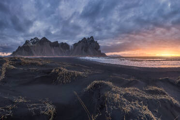 Amazing view of black sand Stockness beach and Vestrahorn mountain in background in Iceland - ADSF48322