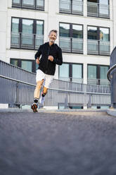 Active sportsman running on footbridge - DIGF20886