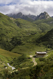 Mountain hut under sky in sunlight - LOMF01394