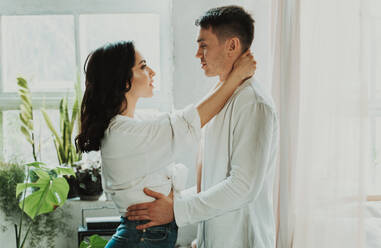 Young couple spending time in their beautiful countryside house - DMDF07607