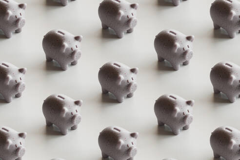 Piggy banks arranged over white background - GCAF00453