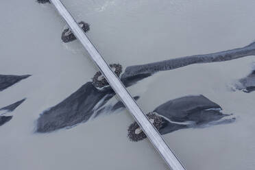 Iceland, Sudurland, Aerial view of bridge over Gigjukvisl river - RUEF04168