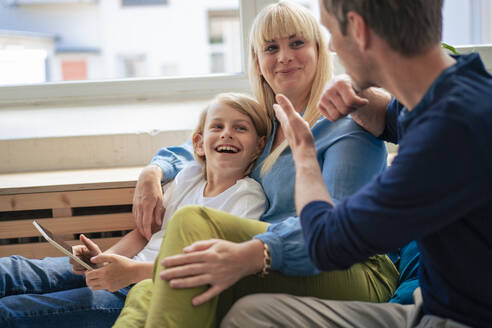 Father talking with mother and son at home - JOSEF21525