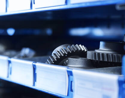 Metal gearwheels on shelf at warehouse - CVF02587