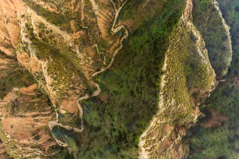 From above aerial view of mountain peaks valley in Barrancas de Burujon in Toledo - ADSF48651