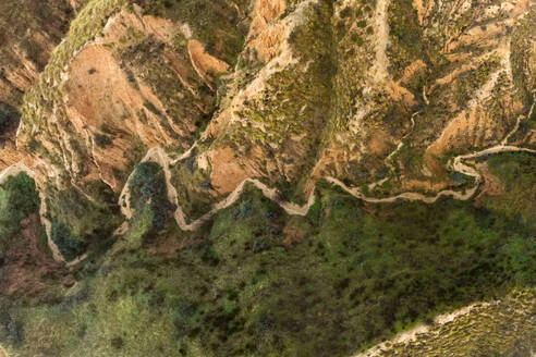 From above aerial view of mountain peaks valley in Barrancas de Burujon in Toledo - ADSF48652