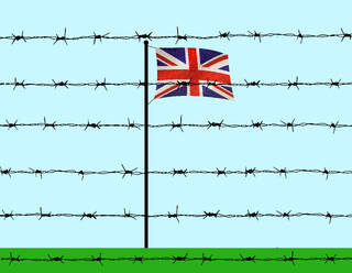 British flag behind barbed wire under blue sky - GWAF00374