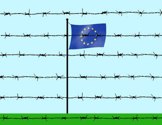 European union flag behind barbed wire under sky - GWAF00379