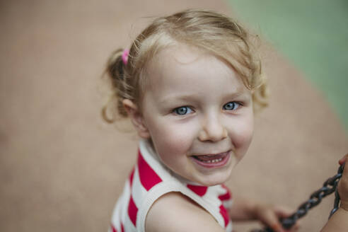 Portrait of little toddler girl having fun at playground - HAPF03444