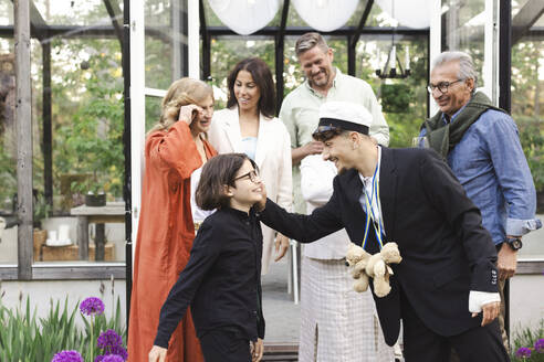 Happy family enjoying during summer party in back yard - MASF40419