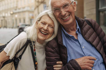 Portrait of happy senior couple in city - MASF40537