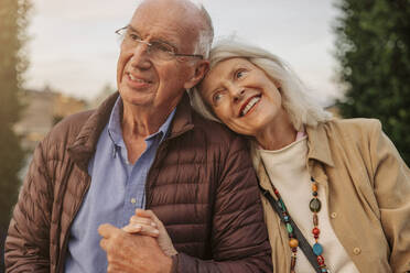 Happy affectionate senior couple holding hands - MASF40565