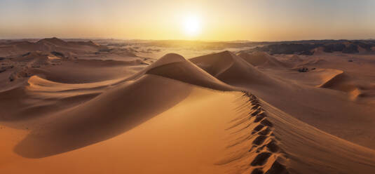 Panoramic Aerial View of sand dunes at sunset in the Sahara desert, Djanet, Algeria, Africa. - AAEF22963