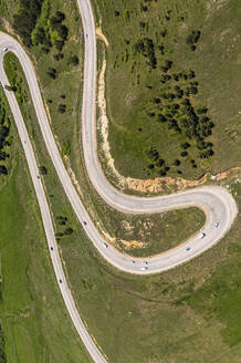 Aerial view of vehicles driving on a mountain road in the Aragatsotn Province of Armenia. - AAEF22985